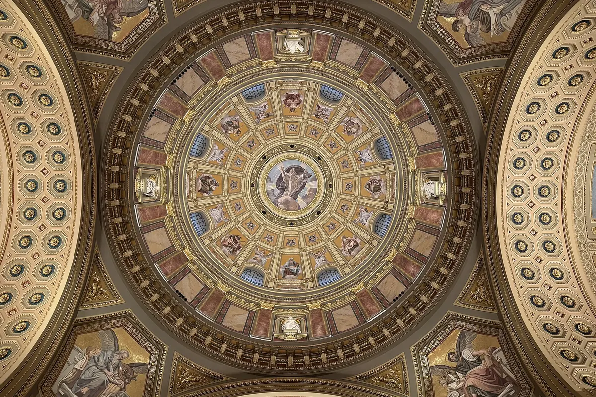 The ceiling of the central dome seen from directly below, with concentric rings of coffering, mosaic figures and gilded ornament.